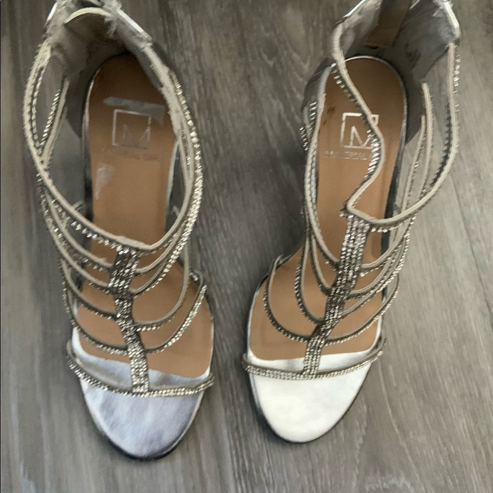 Silver and rhinestone gladiator sandals.
